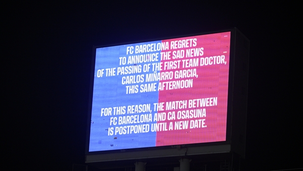 An LED board displays a message detailing why the match was postponed following the death of first team doctor Carles Minarro Garciathe