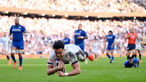Marcus Smith dives over to secure the fourth try bonus for England in their win over Italy