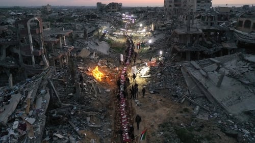 Hundreds of Palestinians in the Tel al-Hawa neighbourhood broke their Iftar at a large table set amidst the rubble in the ruined streets in Gaza City this evening