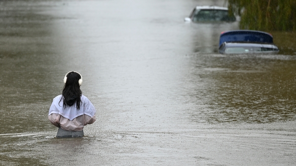 Floodwaters swamped some streets in Brisbane, stranding half-submerged cars in the worst-affected areas
