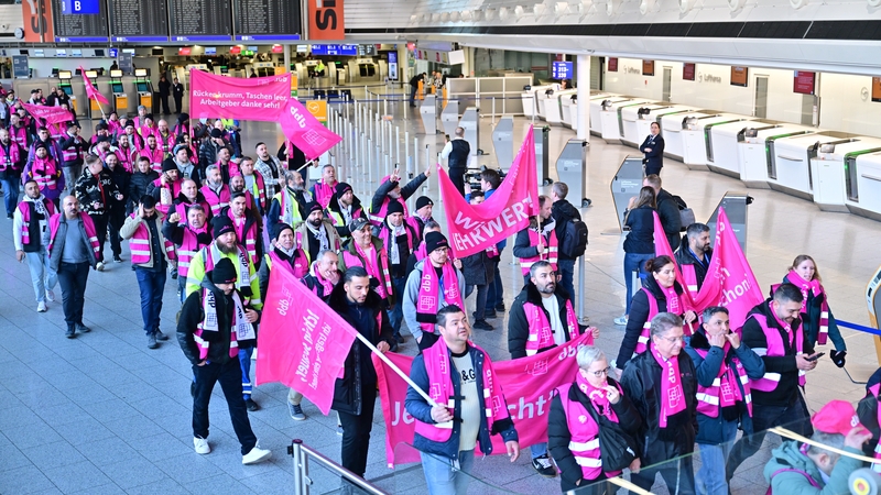 Striking airport workers gather at Frankfurt Airport today