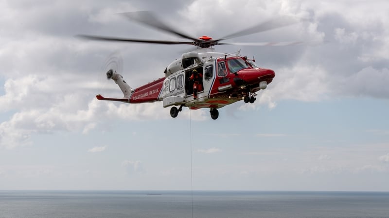 A Coastguard helicopter flying over the sea
