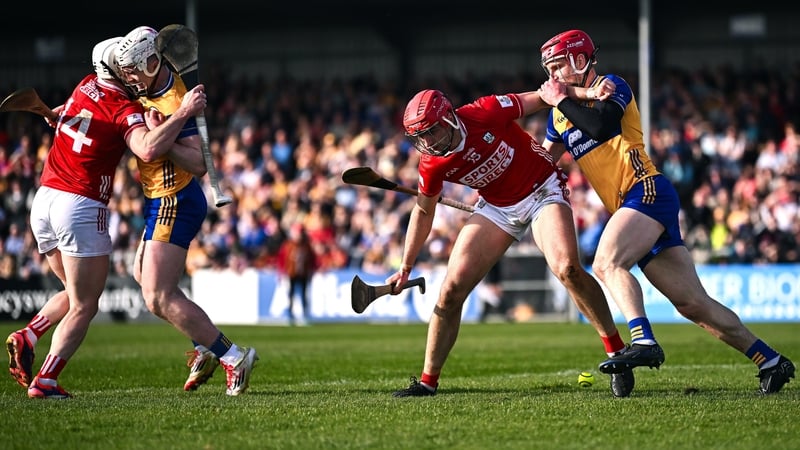 Brian Hayes of Cork and John Conlon of Clare go for the ball as Clare's Adam Hogan and Patrick Horgan tussle off the ball
