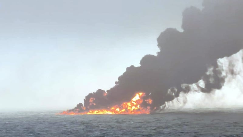 Handout photo of black smoke billowing into the air after a crash between an oil tanker and a cargo ship off the coast of East Yorkshire