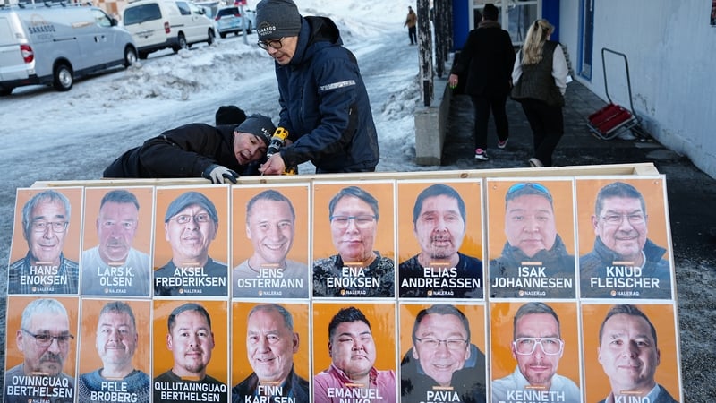 Election posters for Greenland's nationalist Naleraq party are being set up in Nuuk