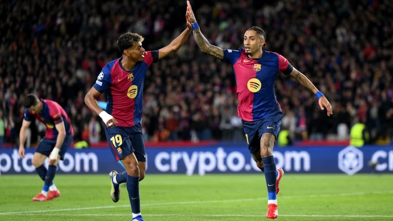 Lamine Yamal celebrates with Raphinha after the latter scored for the hosts