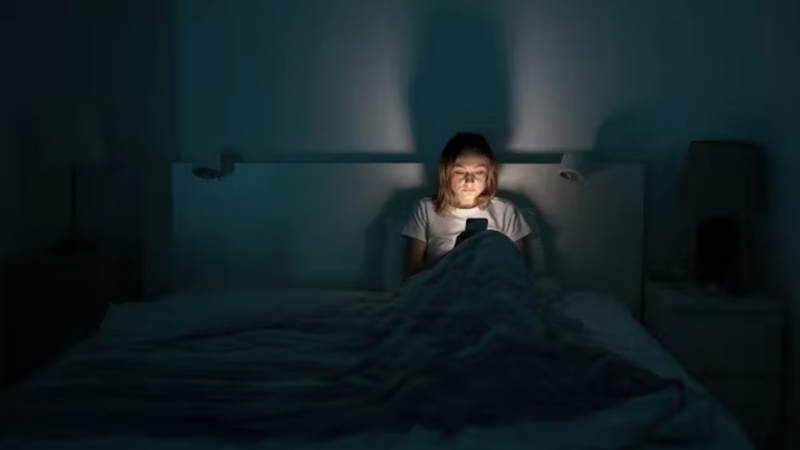 Your late night doomscrolling is doing more than just leading to a bad night's sleep. Photo: Dima Berlin/Shutterstock