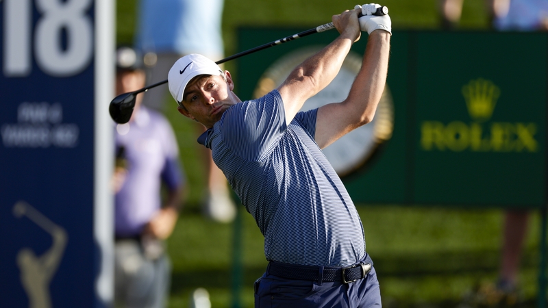 Rory McIlroy tees off on the 18th
