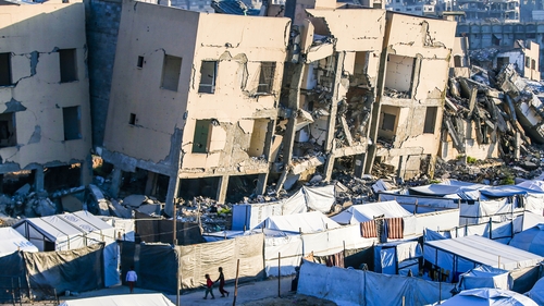 Makeshift tents seen in front of the debris of destroyed buildings in the Sheikh Zayed area of Gaza City