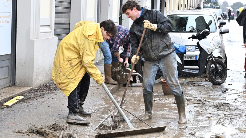 Locals clean up following the flooding in Florence