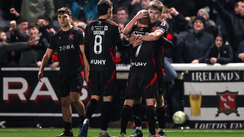 Eoin Kenny of Dundalk, right, celebrates with teammates