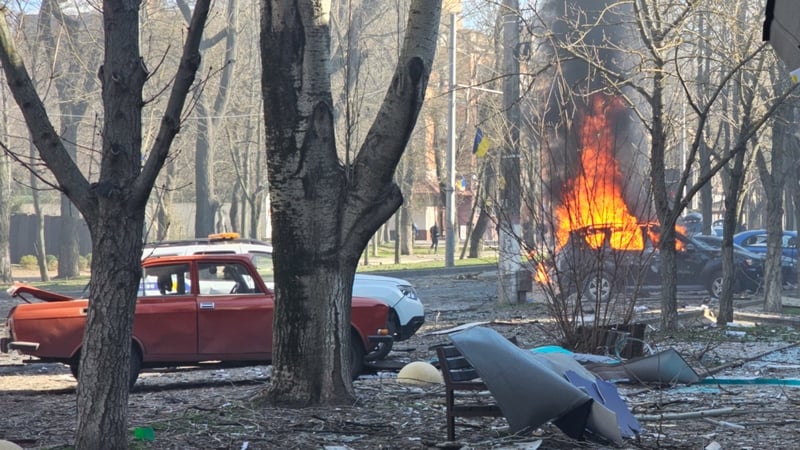 Smoke and flames rising from a car after a Russian airstrike on Kherson, Ukraine