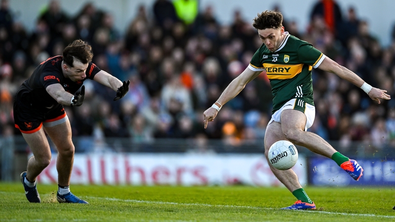 Armagh's Barry McCambridge (L) attempts to block a shot from Kerry forward David Clifford