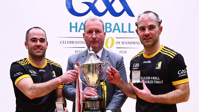 Patrick (left) and Peter Funchion with GAA Handball President Conor McDonell after their win. Photo: Thomas Flinkow