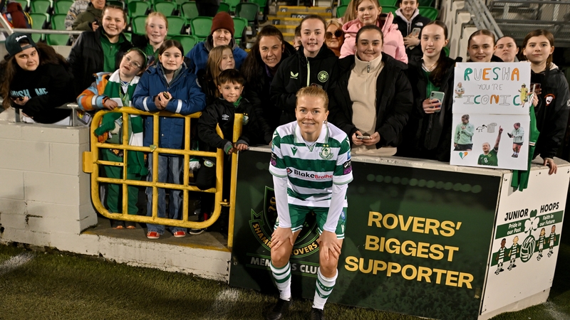 Ruesha Littlejohn poses with Shamrock Rovers supporters after her debut