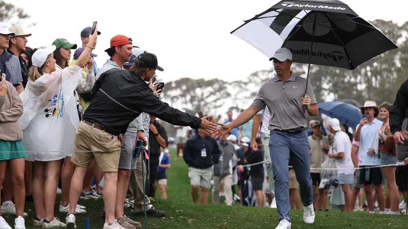 Fans congratulate McIlroy after his birdie on the 11th