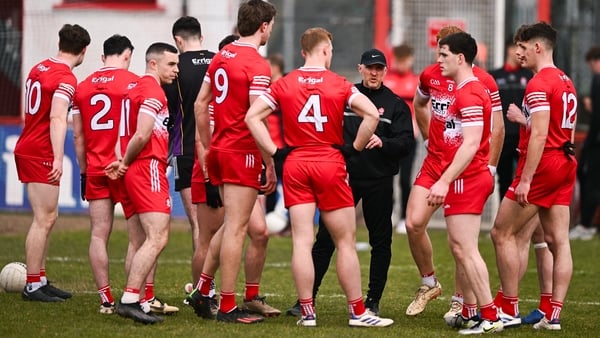 Derry manager Paddy Tally talks to his players