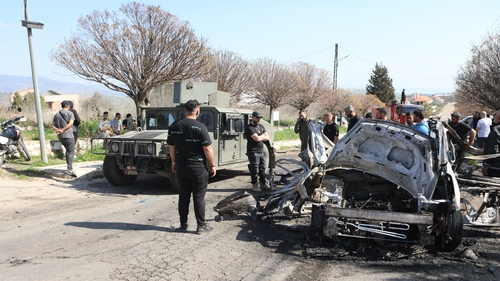 A vehicle targeted by an Israeli airstrike yesterday is seen in the town of Borj El Mlouk in southern Lebanon
