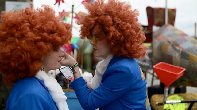 Parade-goers touch up their makeup at the St Patrick's Day festivities in Dublin