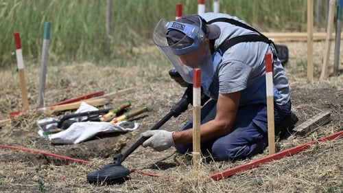 A deminer from the HALO Trust NGO clears mines in a field outside the village of Snigurivka, Mykolaiv region, Ukraine last year