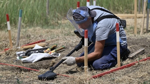 A deminer from the HALO Trust NGO clears mines in a field outside the village of Snigurivka, Mykolaiv region, Ukraine last year