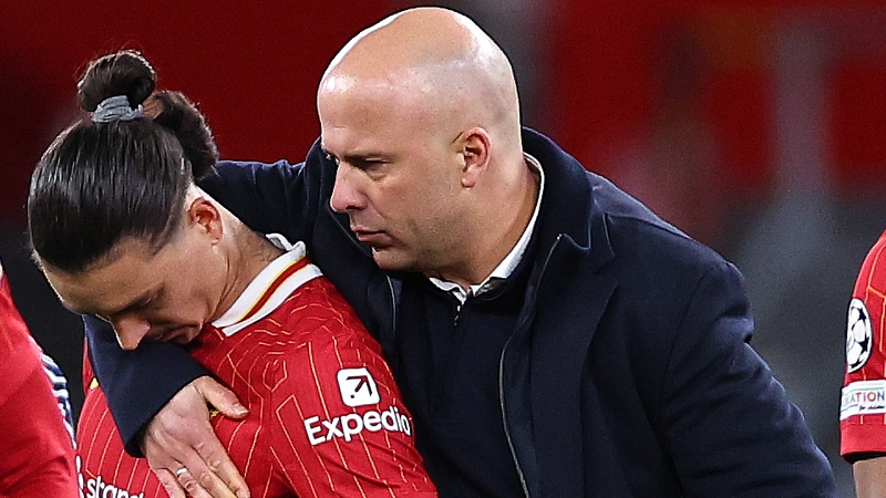 Arne Slot (R) consoles Darwin Nunez after Liverpool's Champions League exit to Paris Saint-Germain