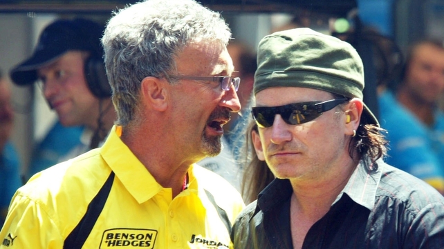 Eddie Jordan and Bono catch up on the grid