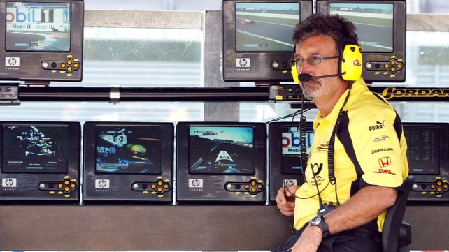 Eddie Jordan looks on from the control booth in 2002