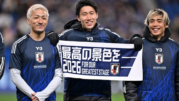 Daizen Maeda, Daichi Kamada and Junya Ito of Japan celebrate