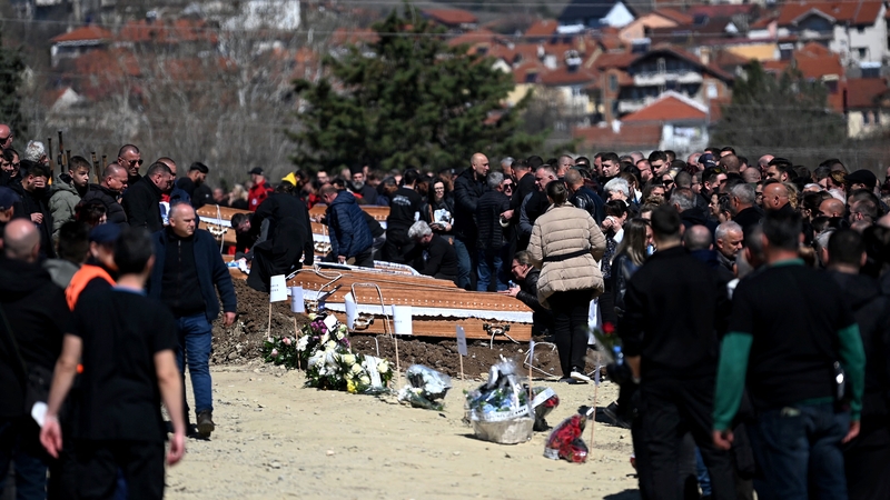 Family and friends gather during funerals for the victims of the nightclub fire in eastern North Macedonia