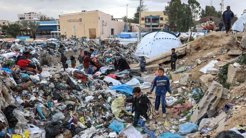 Displaced Palestinians set up camp at a landfill in the Yarmuk area in Gaza City