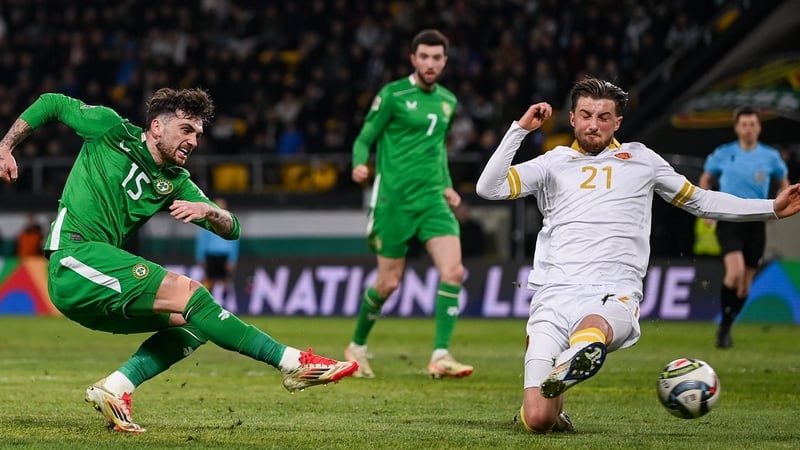 Troy Parrott (L) lashes in a low effort against Bulgaria