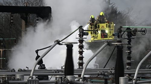 Firefighters at the scene of the major fire at an electrical substation at Heathrow