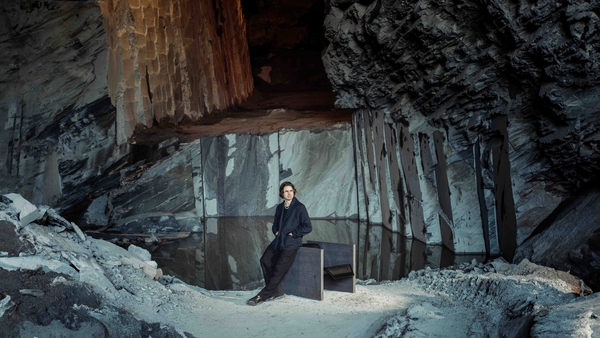 Edwyn James Hickey with his Valentia Slate chair, which is being exhibited by Dublin's Sol Gallery at Art Evolve, at the RDS