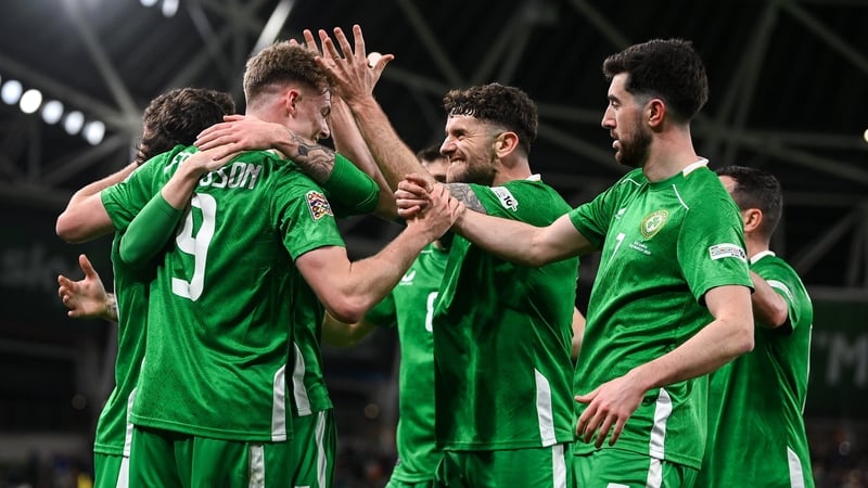 Robbie Brady and Finn Azaz celebrate with Evan Ferguson after the equaliser