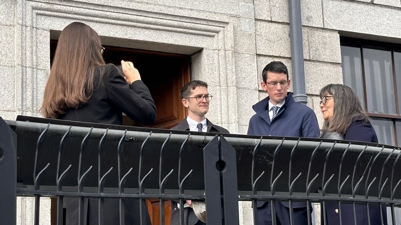 Enoch Burke and his family outside the High Court