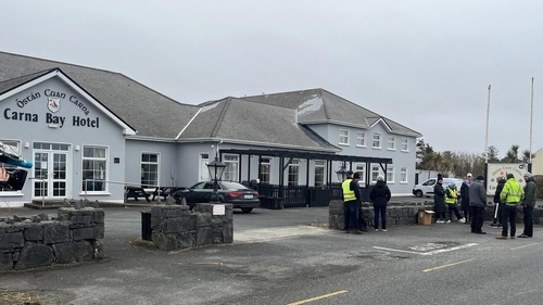 People have gathered outside the Carna Bay Hotel since yesterday evening