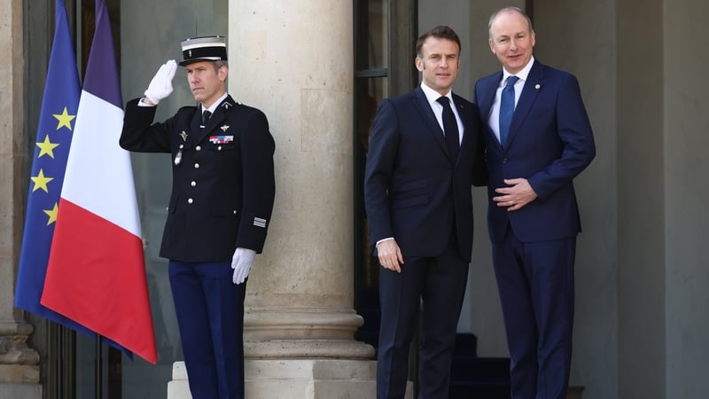 Taoiseach Micheál Martin is greeted by French President Emmanuel Macron ahead of the summit in Paris