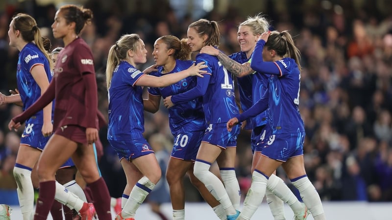 Chelsea players celebrate Nathalie Bjorn's goal against Manchester City