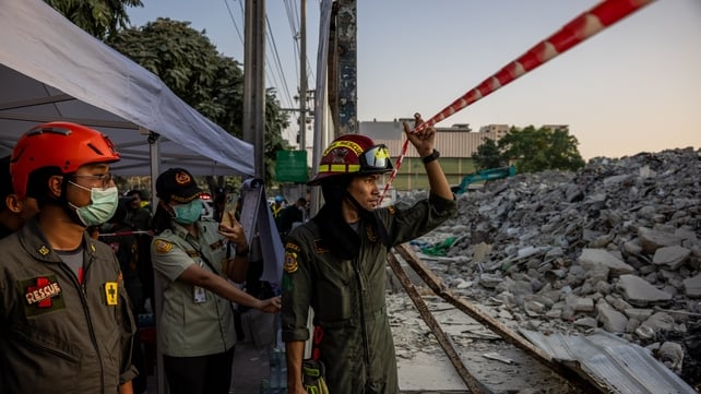 Thai rescue teams provide aid at a construction building collapse in Bangkok's Chatuchak area