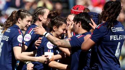 France's Carla Arbez (C) is mobbed by teammates after her try