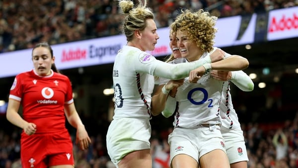 Ellie Kildunne (R) celebrates after scoring her third try