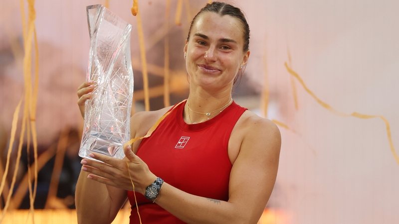 Aryna Sabalenka poses with the Butch Buchholz Trophy