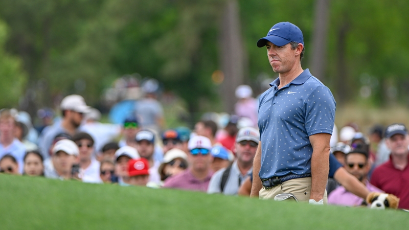 Rory McIlroy looks over his chip on to the green on 3