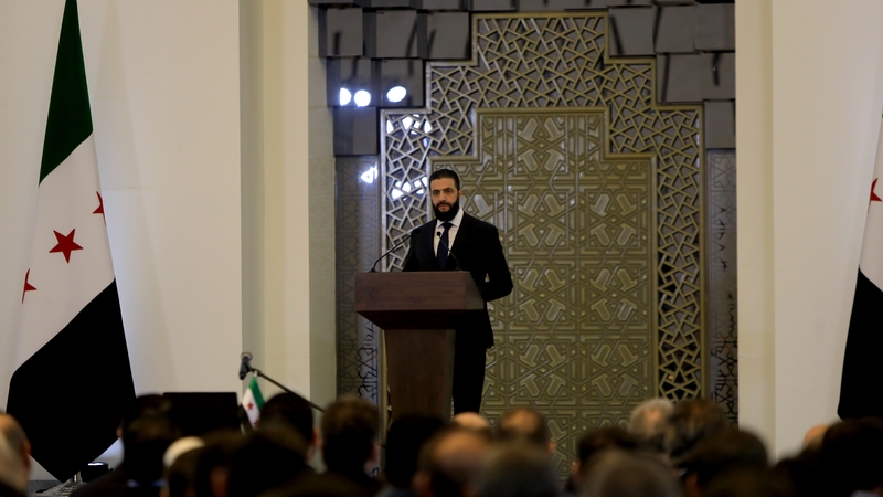 Syrian President Ahmed al-Sharaa makes a speech during the swearing-in ceremony for the first cabinet