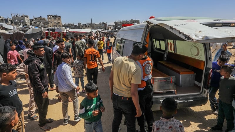 Paramedics bring the injured and deceased to hospital following Israeli attacks on Khan Younis in southern Gaza
