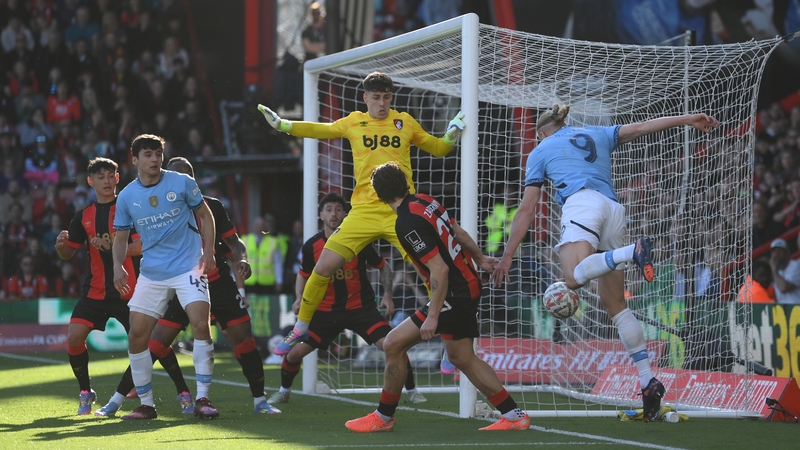 Erling Haaland has a pop at goal against Bournemouth