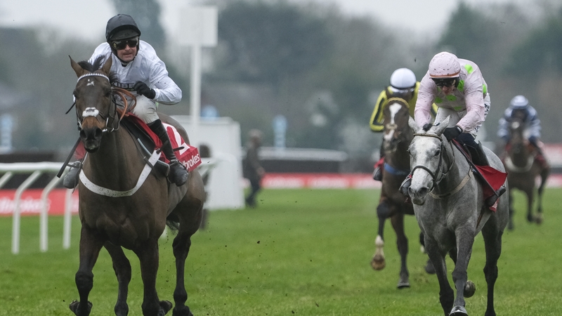 Nico de Boinville riding Constitution Hill (L) clear the last to win the Christmas Hurdle from Paul Townend and Lossiemouth