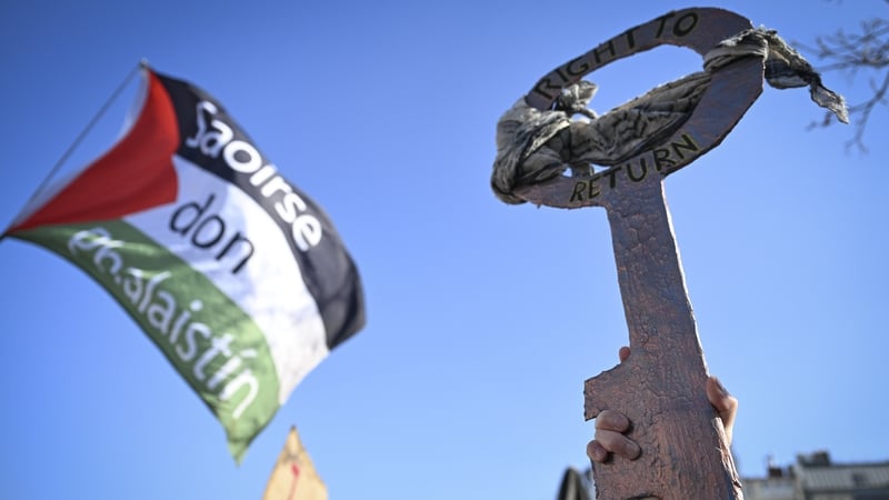 People holding banners and Palestinian flags at Leopold Square in Berlin last week