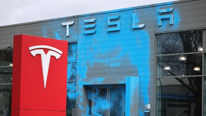 A Tesla car dealership doused in blue paint in Berlin